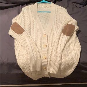 Cream sweater with brown elbow patches